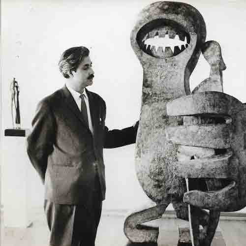 Artist with his artwork, Dragon, bronze, 1963
